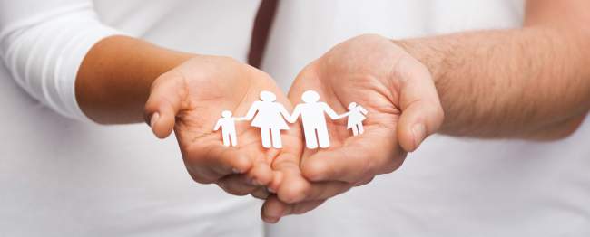 couple hands with paper man family